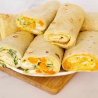 3. Veggies Wrap · 2 Eggs, onion, peppers, tomatoes and mushrooms on a spinach wrap.