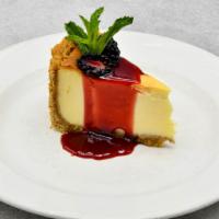 Cheesecake · New York style with raspberry sauce.