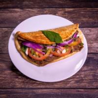 Greek Gyro Sandwich · Sliced gyro meat served on a pita with lettuce, tomatoes, onions, feta and cucumber sauce.