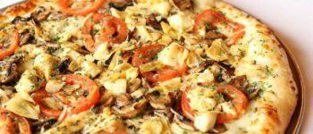 Cade and Blake Pizza with Pesto · Palio's pesto, artichoke hearts, roasted chicken, fresh tomatoes, fresh mushrooms and mozzar...