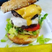 Jackpot Cheeseburger · 100% beef patty with cheddar cheese, lettuce, tomato and onion on a sesame seed bun.