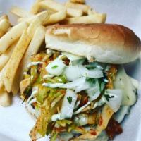 Street Burger · 100% beef patty with lettuce, tomato, cilantro onion mix, spicy slaw and creamy guacamole se...
