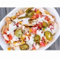 Fremont St. Nachos · Tortilla chips topped with steak or chicken, pico, sizzling hot nacho cheese, spicy sour cre...