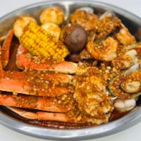Medium Famous Feast · 1 cluster of snow crab, 1/2 lb. new Zealand green mussel, 1/2 lb. headless shrimp, 1 corn on...