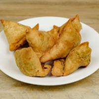 Vegetable Samosa · 1 piece. Crispy crust turnovers filled with potatoes peas and spices.