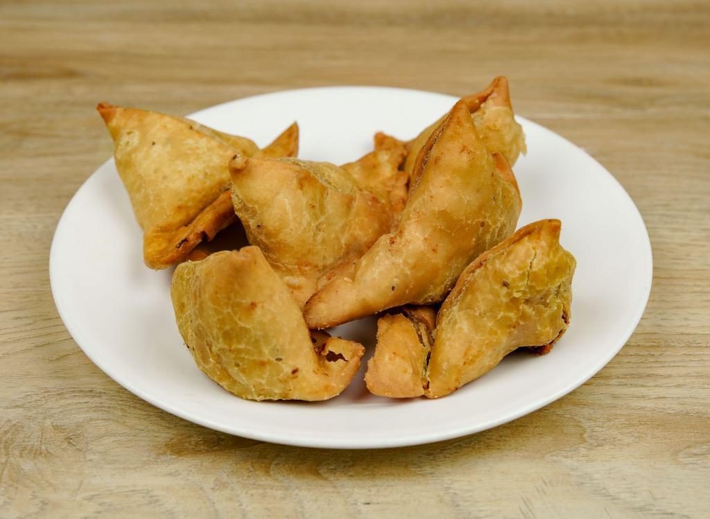 Vegetable Samosa · 1 piece. Crispy crust turnovers filled with potatoes peas and spices.