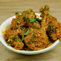 Chicken Curry · Chicken prepared with tomatoes, herbs, and spices.