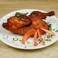 Punjabi Steam Roast Specialty · 1/2 chicken, marinated in special Punjabi sauce, steamed then roasted in clay oven.