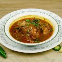 Goat Paya · Goat feet, cooked in a very thick gravy, served with fresh coriander and green chilies.