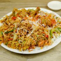 Chicken Biryani · Basmati rice cooked with delicious chicken, herbs, and spices.