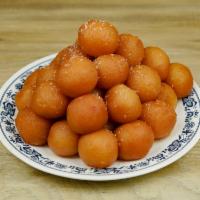 Gulab Jamun · 2 pieces. Deep fried dough balls made with flour and dry milk, soaked in flour syrup.
