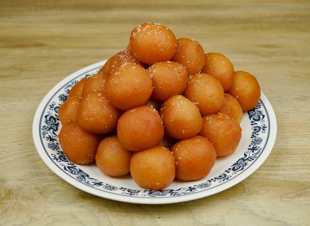 Gulab Jamun · 2 pieces. Deep fried dough balls made with flour and dry milk, soaked in flour syrup.