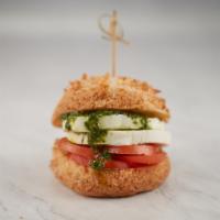 Pao de Queijo - Caprese · Gluten free Brazilian cheese bread filled with fresh mozzarella and tomatoes.