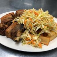 Fried Pork Belly · Chicharrones. Served with carrot and cabbage salad and tostones or fried yuca.
