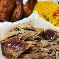 Lechon Plate · Slow roasted pork served with your choice of arroz con gandules, maduros or tostones con ajo.