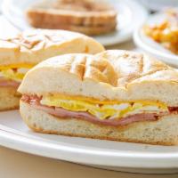 2 Eggs on a Roll with Ham and cheese · 