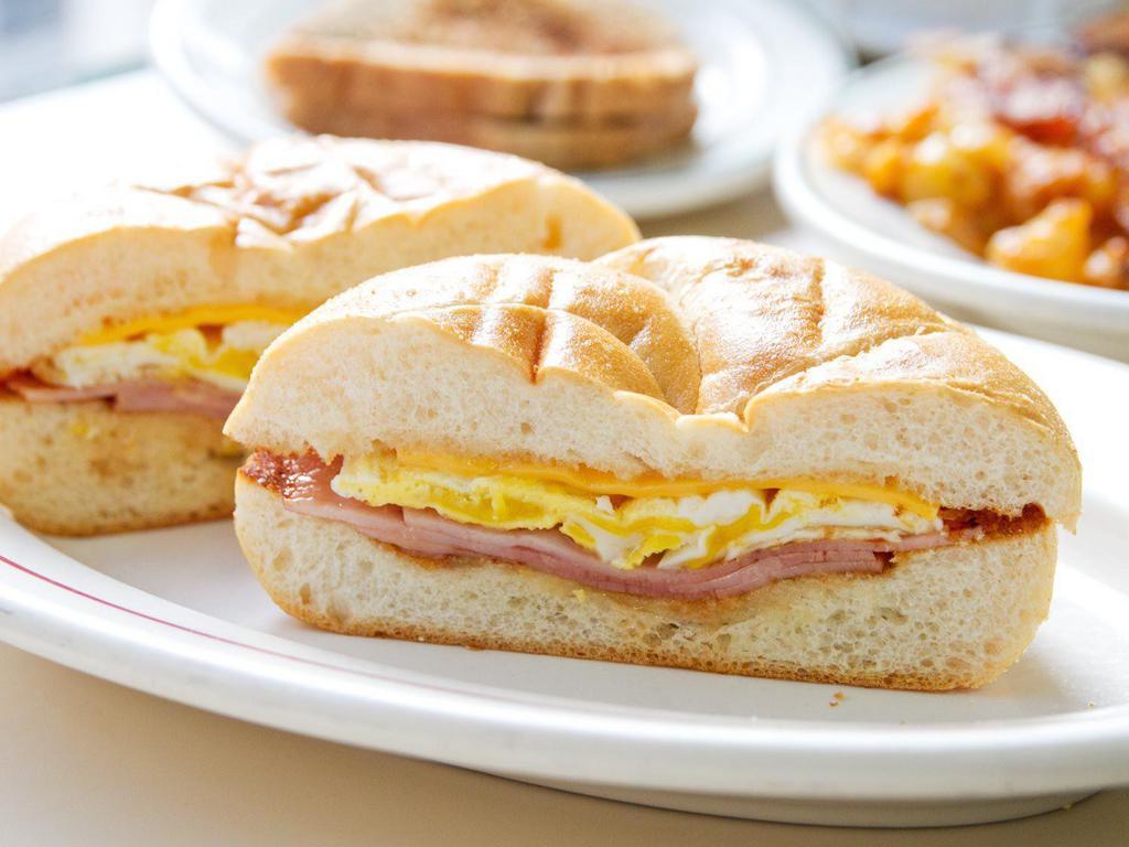 2 Eggs on a Roll with Ham and cheese · 