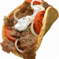 Lamb  or chicken Gyro sandwich · It comes on a Pita bread with mixed green salad 
 White sauce and hot sauce if you like