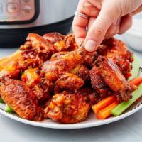 Hot Wings · Cooked wings of a chicken coated in sauce or seasoning. 