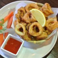 Crispy Fried Calamari · Crispy golden fried calamari with Thai sweet chili sauce.