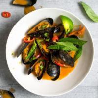 Mussels · Sweet and rich mussels cooked in a tomato sauce.