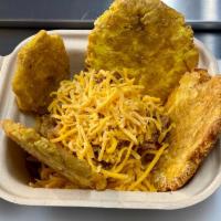 Tostonbowl  · Tostones are crispy, hash brown-like rounds that are made from green plantains and then slic...