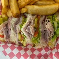 Trio Club · Ham, turkey, and roast beef. Served with a side of house dill mustard and fries.