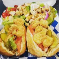 Shrimp Po Boy Sandwich · Dressed with lettuce, tomatoes, pickles, and house sauce. Add cheese for an additional charge.