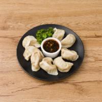 7. Steamed Dumplings · 8 pieces.