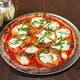 Margarita Pizza · Sauce, light fresh mozzarella, sliced tomatoes, and basil.
