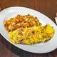 Western Omelette Breakfast · Ham, peppers, and onions blended with Swiss and cheddar cheese.