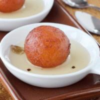 Gulab Jamun - 1 pc · Fried balls of milk pastry soaked in honey and saffron syrup.