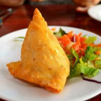 Samosa - 1 pcs · Golden crisp triangle filled with mildly spice potatoes and peas.
