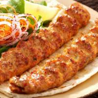 Chicken Seekh Kabaab · Mildly-Spiced minced chicken wrapped on skewer, roasted in clay oven.