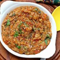 Baigan Bharta · Roasted eggplant minced and cooked with onions and tomatoes.