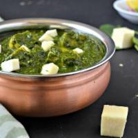 Palak Paneer · Fresh spinach cooked with cubes of home made cheese mildly spiced.