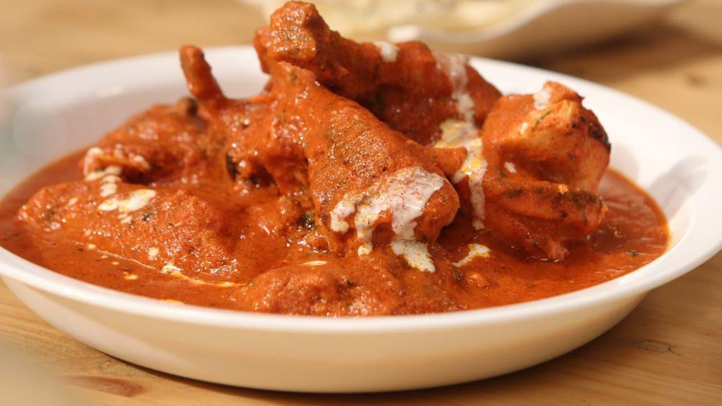 Dilli Wala Butter Chicken (With Bone) · Delhi's (INDIA) famous Bone in Butter Chicken prepared with special sauce and Tandoori welldone Chicken.