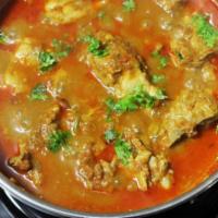 Chicken Curry · Bone-in chicken cooked in delicately lightly spiced curry sauce.