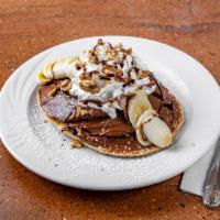 Nutella Pancakes · Nutella, bananas, walnuts and whipped cream. 