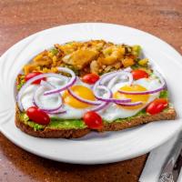 Avocado Toast · Sunny side up eggs, red onions, smashed avocado, cherry tomatoes and lemon on multi-grain.