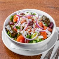 Greek Salad · Mixed greens, onions, peppers, tomato, cucumber, Kalamata olives, imported feta, stuffed gra...