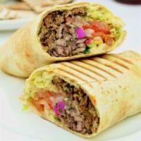 Shawarma Wrap · Grilled marinated lamb and beef in a toasted pita bread. Includes onions, tomatoes, pickles ...