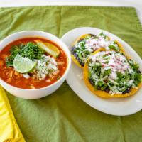 Pork Pozole Soup · Mexican white hominy with pork soup – to warm you up. Served with two tostadas.