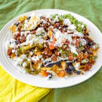 Nachos Sencillos  (MEATLESS) · Corn chips with refried beans, melting cheese, fresco cheese, sour cream, guacamole and pick...