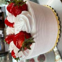 Strawberry Shortcake · Yellow sponge soaked with vanilla syrup, filled with fresh strawberries and whipped cream.