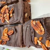 Brownies · Covered in fudge with pecan nuts.