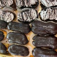 Mini Eclairs · Specify open or closed. Open are filled with chocolate custard and topped with whipped cream...
