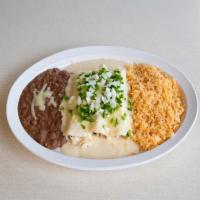 Sour Cream Chicken Enchiladas Plate · Chicken enchiladas topped with sour cream sauce and cheese, served with rice and beans, garn...