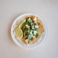 Taco (Flour Tortilla) - Single · A hand made flour tortilla topped with your choice of meat, cilantro, and onions.