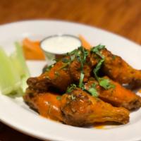 Buffalo Chicken Wings · Served with carrots celery and a choice of homemade ranch or blue cheese dressing.